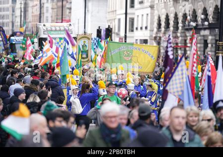 Participants and crowds during the St Patrick's Day festival and parade in central London. Picture date: Sunday March 12, 2023. Stock Photo