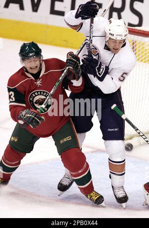 Petteri Nummelin of the Minnesota Wild plays the puck against the