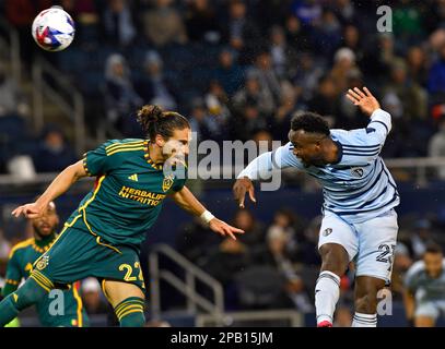 Kansas City, USA. 11th Mar, 2023. Sporting Kansas City forward Willy Agada (23, right) heads the ball towards the goal as Los Angeles Galaxy defender Jalen Neal (24) defends. Major League Soccer game on March 11, 2023 at Children's Mercy Park Stadium in Kansas City, KS, USA. Photo by Tim Vizer/Sipa USA Credit: Sipa USA/Alamy Live News Stock Photo