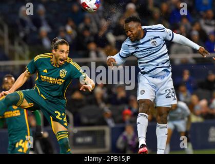 Kansas City, USA. 11th Mar, 2023. Sporting Kansas City forward Willy Agada (23, right) heads the ball towards the goal as Los Angeles Galaxy defender Jalen Neal (24) defends. Major League Soccer game on March 11, 2023 at Children's Mercy Park Stadium in Kansas City, KS, USA. Photo by Tim Vizer/Sipa USA Credit: Sipa USA/Alamy Live News Stock Photo