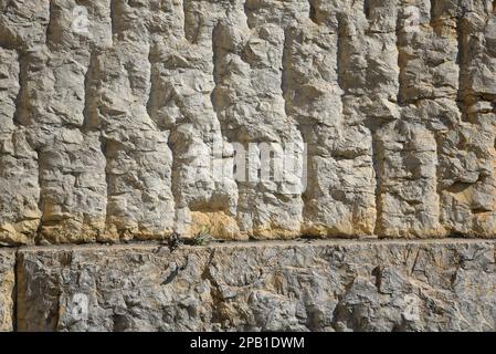 Ancient tephrocyan Eleusinian stone wall known as 'Lycurgio'at the Archaeological Site of Goddess Demeter in Eleusis, Attica Greece. Stock Photo