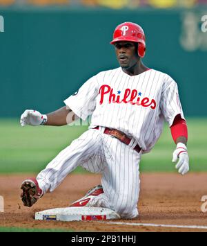 Philadelphia Phillies' Jimmy Rollins makes the turn at second base