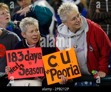 Seattle Mariners fans Judy Shannon, Seattle, left, and Joan Carlson,  Enumclaw, Wash., right, try to get the attention of players before the  final baseball game of the season against the Oakland Athletics