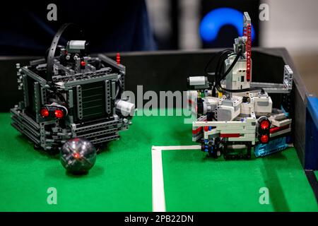 Berlin, Germany. 12th Mar, 2023. Two robots compete for the ball at the Soccer qualifying tournament of RoboCup Junior. 164 students from 14 schools and institutions are taking part in RoboCup Junior in Germany. Credit: Fabian Sommer/dpa/Alamy Live News Stock Photo