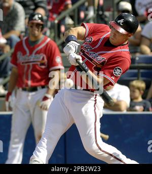 Mark Teixeira of the Atlanta Braves is congratulated by Jeff