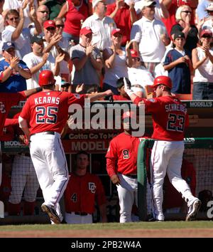 Philadelphia Phillies second baseman Chase Utley, left, puts out Washington  Nationals Nook Logan, caught trying to steal second base in the third  inning of a baseball game in Philadelphia on Thursday, July