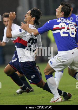 Genoa forward Marco Borriello left stops the ball next to Torino