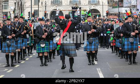 London, UK. 12th Mar, 2023. A group of Irish pipers take part to celebrate St Patrick. The annual St Patrick's Day Parade makes its way through central London to celebrate London's Irish community and Irish culture and heritage with participants in costumes, marching bands, pageantry and more, watched by spectators along the route. Credit: Imageplotter/Alamy Live News Stock Photo