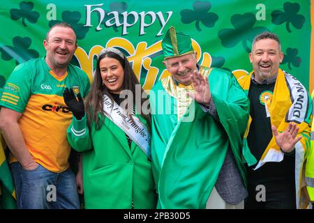 London, UK. 12th Mar, 2023. Members of the Donegal Association pose for a group shot. The annual St Patrick's Day Parade makes its way through central London to celebrate London's Irish community and Irish culture and heritage with participants in costumes, marching bands, pageantry and more, watched by spectators along the route. Credit: Imageplotter/Alamy Live News Stock Photo