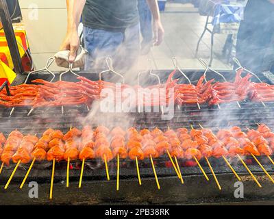 fry or bbq food (chicken, fish ball) in open night food market in Brunei Stock Photo