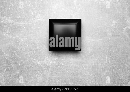 Black light switch on grey background, top view Stock Photo
