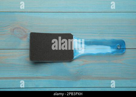 Foot file on light blue wooden table, top view. Pedicure tool Stock Photo