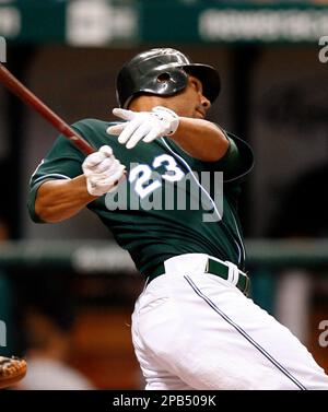 Tampa Bay Devil Rays' Carlos Pena watches his solo home run off