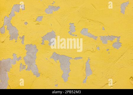 Background texture of a painted cement wall with peeling paint Stock Photo