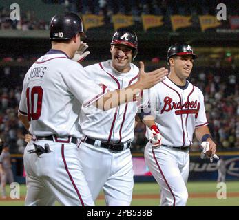 Atlanta Braves' Mark Teixeira, left, celebrates with Andruw Jones