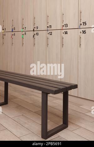 Wooden bench near lockers in changing room Stock Photo