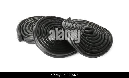 Tasty black liquorice candies on white background Stock Photo - Alamy