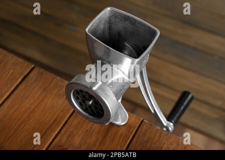 Manual vintage meat grinder and ripe tomatoes on the table. Making homemade  tomato sauce. Use of outdated kitchen utensils Stock Photo - Alamy