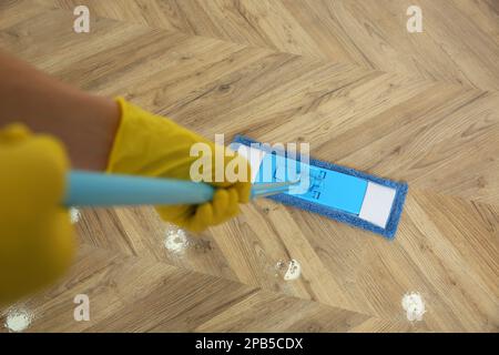 Closeup Of Janitor Sweeping Hardwood Floor Stock Photo - Download