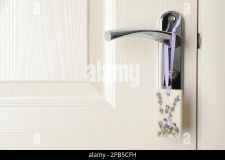 Scented sachet with flowers and stylish clothes on hanger Stock Photo -  Alamy