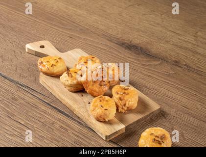 National Hungarian buns with caraway seeds on a wooden background. Stock Photo