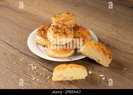 National Hungarian cuisine. Buns with cumin and fat on a white plate. Stock Photo