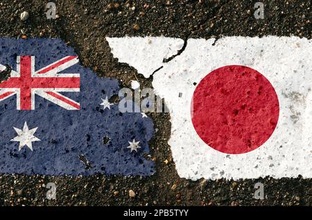 On the pavement there are images of the flags of Australia and Japan, as a confrontation between the two countries. Conceptual image. Stock Photo