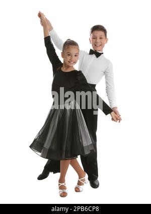 Beautifully dressed couple of kids dancing on white background Stock Photo