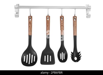 Metal rack with set of kitchen utensils on white background Stock Photo
