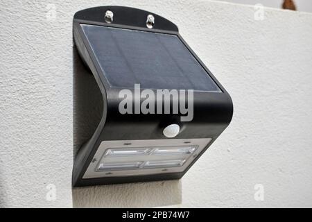solar powered motion activated outdoor security light on a wall in a property in Lanzarote, Canary Islands, Spain Stock Photo