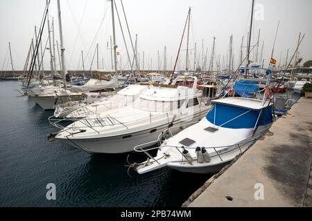 power boats and yachts with winter covers in place during calima in puerto calero marina Lanzarote, Canary Islands, Spain Stock Photo