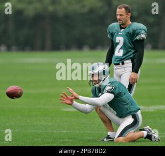 Jacksonville Jaguars' Brian Iwuh (59) and Jorge Cordova (58) pummel  Philadelphia Eagles punter Dirk Johnson after he punted the ball at Lincoln  Financial Field in Philadelphia, Pennsylvania, Sunday, October 29, 2006. The