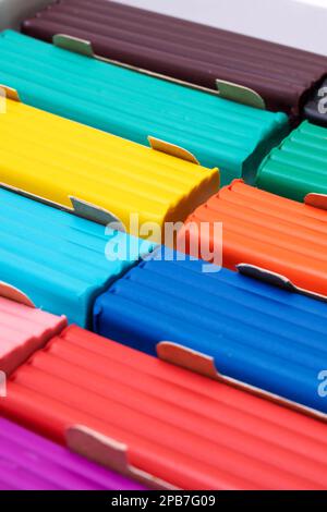 Multi-colored plasticine in a box close-up, background or texture Stock Photo