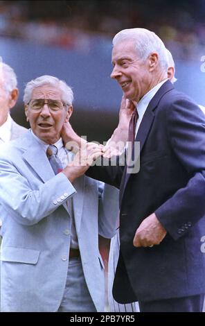 ** FILE ** Former New York Yankees teammates Phil Rizzuto, left