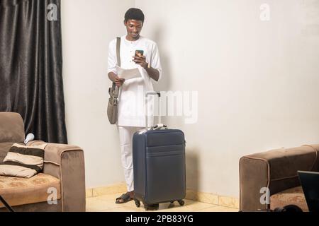 Full length body size side profile photo of man carrying his baggage holding passport and tickets Stock Photo