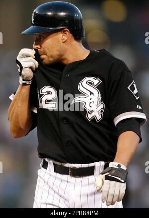 Chicago White Sox's Scott Podsednik watches his teammate's play against the  Seattle Mariners during the second inning of a baseball game, Friday, Aug.  10, 2007, in Chicago.(AP Photo/Nam Y. Huh Stock Photo 