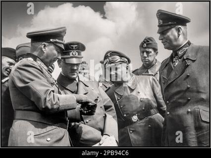 WW2 WESTERN FRONT Adolf Hitler on the Western Front discusses the situation with his Nazi SS and Wehrmacht officers. Visible include: General Gunther von Kluge (foreground 1st from the left), Wilhelm Keitel (1st from the right). Depicted People Wilhelm Keitel, Gunther von Kluge, Adolf Hitler Date March 1940 Stock Photo