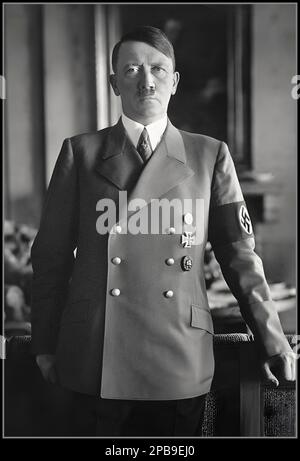 Adolf Hitler half length interior portrait by Photographer Hoffmann,  born: April 20, 1889 in Braunau am Inn, died: suicide April 30, 1945 in Berlin; chairman of the NSDAP; from January 30, 1933 Reich Chancellor, from August 12, 1934 Führer and Reich Chancellor; since February 4, 1938 Commander-in-Chief of the Wehrmacht and from December 19, 1941 Commander-in-Chief of the Army. He is primarily responsible for the murder of millions of people, prepared for and triggered World War II. He escaped responsibility by committing suicide in his underground Berlin Bunker Stock Photo