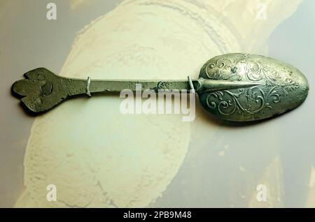 A decorative pewter spoon from the slave ship Henrietta Marie circa 1700 is displayed at GulfQuest Museum in Mobile, Alabama. Stock Photo