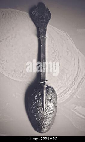 A decorative pewter spoon from the slave ship Henrietta Marie circa 1700 is displayed at GulfQuest Museum in Mobile, Alabama. Stock Photo