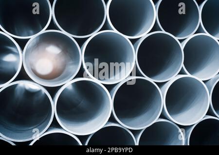 PVC pipes bacground, background of big plastic pipes used at the building site. Stock Photo