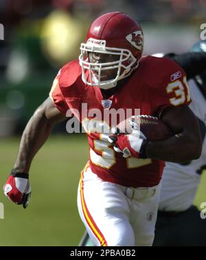 FILE ** Kansas City Chiefs running back Larry Johnson (27) slips past San  Diego Chargers' Donnie Edwards as he goes in for a 11-yard touchdown run in  the second quarter of