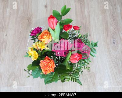 Bouquet of flowers with roses, tulips, carnations, alstroemeria Stock Photo