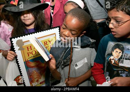 An employee of Britain's Royal Mail counts sheets of Harry Potter stamps  ready to be put on sale for the first time at Trafalgar Square Post Office  in London, Tuesday, July 17, 2007. Harry Potter stamps have already broken  records to be the most anticipated