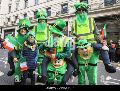 London, UK. 12th Mar, 2023. A group of leprechauns pose. The annual St Patrick's Day Parade makes its way through central London to celebrate London's Irish community and Irish culture and heritage with participants in costumes, marching bands, pageantry and more, watched by spectators along the route. Credit: Imageplotter/Alamy Live News Stock Photo