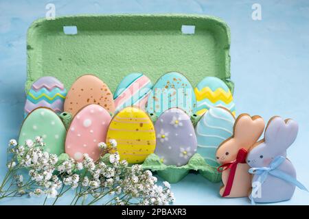 Homemade ginger cookies for Easter. Egg-shaped cookies placed in an egg tray. Easter holiday concept. Stock Photo