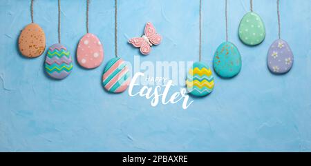 Banner for the Easter holiday. Egg-shaped cookies placed in an egg tray. Easter holiday concept. Place for text. Top view. Stock Photo