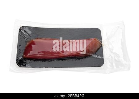 Vacuum packed tuna on a white background. A piece of fresh tuna in the package close-up on a white background. Stock Photo