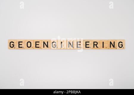 Wooden title spelling the word geoengineering isolated on a white background Stock Photo