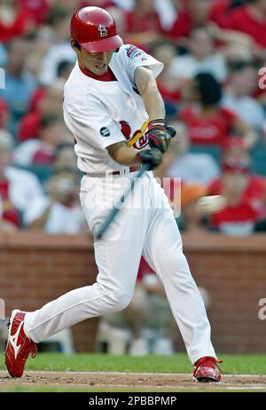 St. Louis Cardinals' So Taguchi of Japan follows through on a two